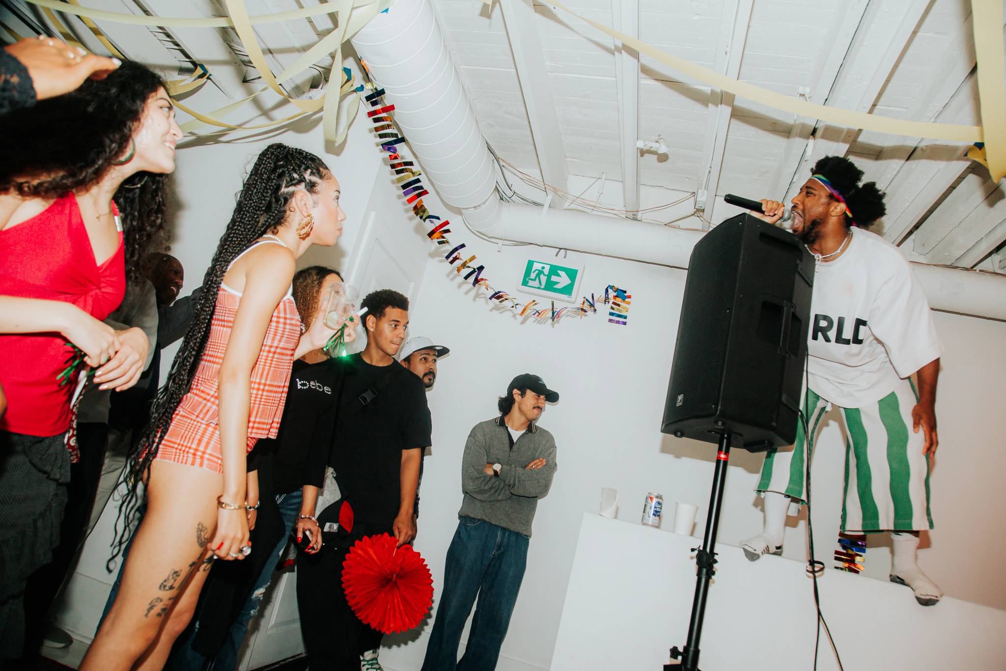KEND! performing THE WALL! standing atop a stair landing